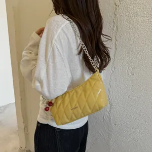Trendy quilted shoulder bag for women with chain strap and stylish baguette design.