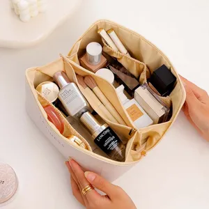 Large capacity PU leather cosmetic bag with compartments, perfect for travel storage and daily use.