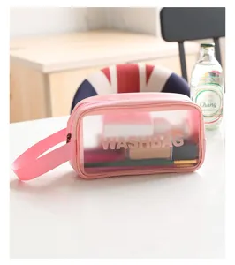 Sac de lavage rose transparent en PVC avec poignée, idéal pour le voyage et quotidien.