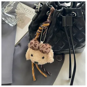 Black quilted bucket bag with cute curly puppy plush charm stylish daily commute women bag