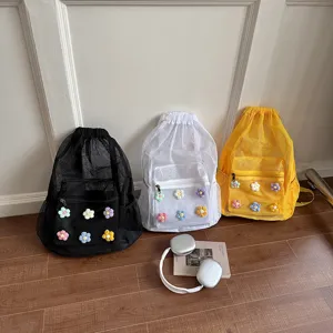 Stylish mesh drawstring backpack with cute crochet flowers, casual Korean style daypack for school.