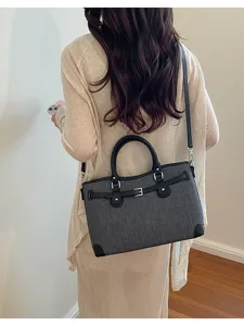 Stylish women's dark grey shoulder bag with black leather trim, perfect for daily commuting.
