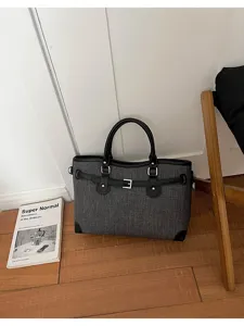 Minimalist structured shoulder tote bag for women, chic daily commute handbag with belt accent.
