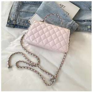 Pink quilted shoulder bag with chain strap and top handle detailed view for daily fashion style.
