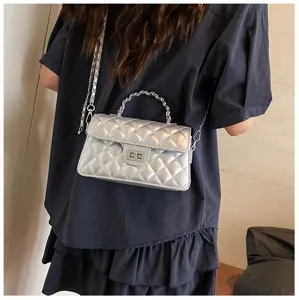 Silver quilted chain shoulder bag detail shot, elegant women crossbody purse with metal lock.