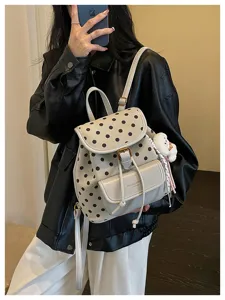 Casual large capacity polka dot backpack for women stylish retro travel school bag commute.