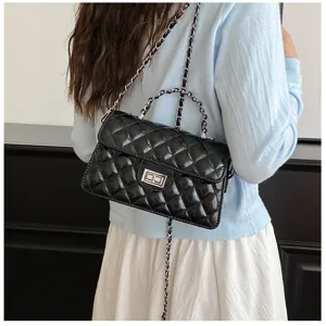 Detailed view of the black quilted chain shoulder bag, showing glossy leather and silver hardware.