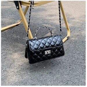 Black quilted shoulder bag with chain strap and top handle. Elegant chic women handbag for daily use.
