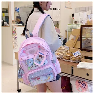 Mochila escolar rosa muy bonita para estudiantes con bolsillo delantero transparente.