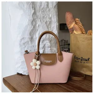 Korean pink dumpling handbag with flower charm, chic shoulder crossbody tote bag for women.
