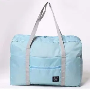 Light blue large capacity foldable travel duffel bag with handles and front zipper pocket.