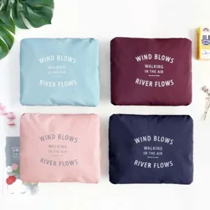 Foldable travel storage bag large capacity clothes organizer for luggage suitcase usage.