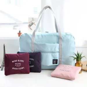 Large capacity foldable travel duffel bag with luggage strap and multiple storage pouches.
