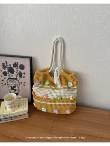 Detailed view of the Korean style crochet tote bag with colorful floral appliques and rope handles.