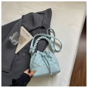 Light blue quilted bucket bag for women, stylish crossbody and single shoulder fashion handbag.