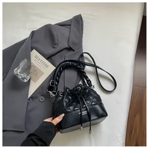 Stylish black quilted bucket bag with braided handle, versatile crossbody and shoulder purse.