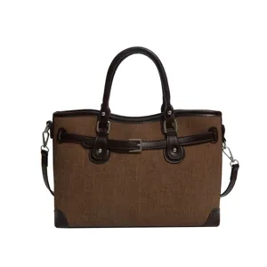 Stylish brown women commuter shoulder handbag with belt design, elegant tote bag main view.