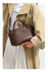 Detailed view of the retro brown bowling handbag, showing premium material and texture.