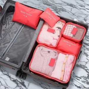 Travel packing cubes set for suitcase, portable luggage organizers for clothes and travel essentials.