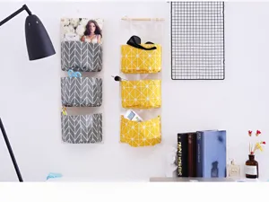 Fabric hanging storage bag detail showcasing multiple pockets for neat wall room storage.