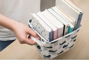 Fabric storage basket detail view showcasing durable linen material and sturdy handles.