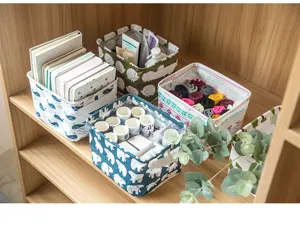 Cotton linen storage basket detail showing fabric texture, sturdy handles, and neat organization.