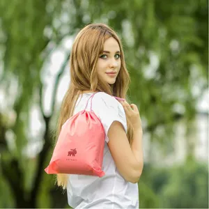 Pink PVC waterproof drawstring storage bag for travel, shoes, socks, and daily sundries organization.