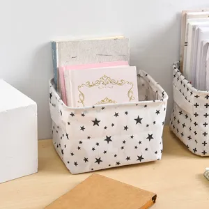 Cotton linen desktop storage basket with black star pattern for home and office organization.