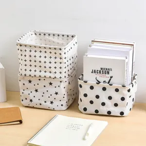 Cotton linen desktop storage basket with cute geometric patterns, ideal for home sundries.