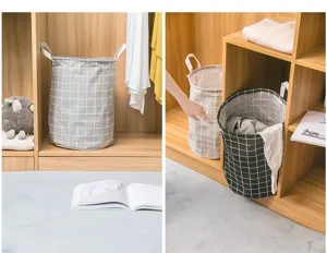 Detailansicht des faltbaren Stoff-Wäschekorbs mit Karomuster, praktischen Griffen und Stauraum.