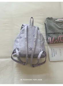 Sac à dos décontracté violet clair avec motif étoile, sac d'école stylé pour femme et quotidien.