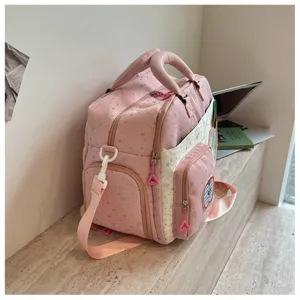 Details of the pink star print travel duffel bag, showing large capacity and stylish design.