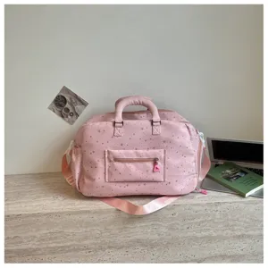 Pink star print travel duffel bag detail, large capacity casual sports gym bag for women.