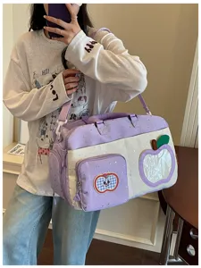 Large capacity casual travel bag for women, lightweight purple crossbody shoulder bag with cute apple design.