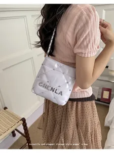 Trendy quilted women shoulder bag with diamond chain strap and elegant vintage style design.
