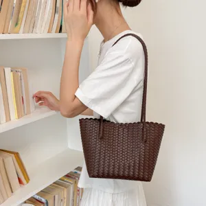 Dark brown woven tote bag for women, simple chic shoulder handbag for daily fashion style.