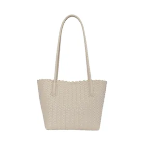 Minimalist beige woven tote bag for women, stylish shoulder bag with comfortable double handles.