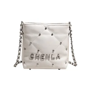 White quilted shoulder bag with chain strap and rhinestone details for women fashion daily use.