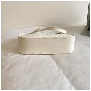 Minimalist off-white underarm bag for women, stylish casual shoulder bag with sleek design.