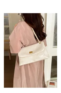 Stylish white quilted shoulder bag with gold chain strap, perfect for daily commute and casual wear.