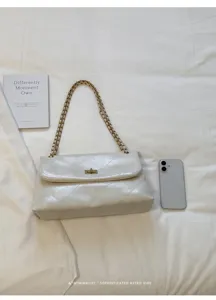 Chic white quilted chain shoulder bag for women, elegant retro commuter crossbody bag.