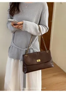 Women brown quilted chain shoulder bag, stylish retro commuting crossbody bag for summer.