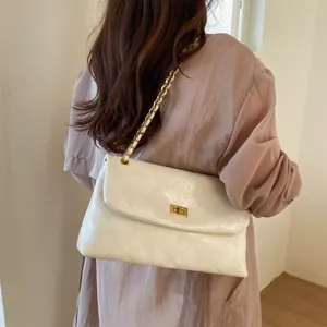 White quilted leather shoulder bag with gold chain strap, stylish commute crossbody bag for women
