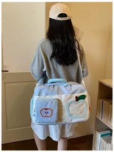 Detailed view of the large capacity casual travel crossbody bag with cute star pattern and apple design.