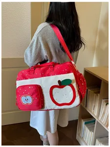 Large capacity travel shoulder bag, casual red star print duffel bag with cute apple design.