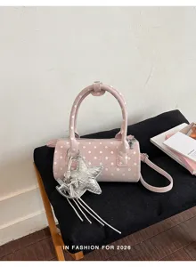 Sac à main cylindrique rose à pois pour femmes, élégant sac bandoulière baril avec breloque.