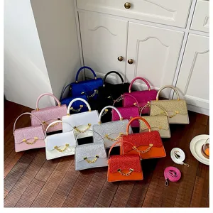 Glitter top handle bag variant detail showcasing vibrant colors, elegant design, and stylish chain.