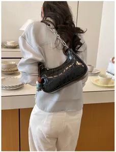 Chic black crocodile pattern hobo shoulder bag with metal chain strap for women daily use.