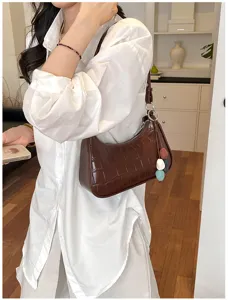 Brown crocodile pattern underarm shoulder bag detail, elegant casual daily wear accessory.