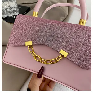 Pink glitter flap shoulder bag detail showcasing exquisite gold chain and premium hardware.